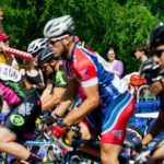 Sarah Miller watches the Mens 3-4 race from her father Sam's shoulders during the Historic Roswell Criterium on Sunday, April 29, 2012.