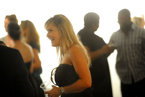 Kathie Swenn talks with others during a VIP pre-show reception for the opening night of "Stripped" at the Ferst Center for the Arts on the campus of Georgia Tech on Thursday, July 28, 2011.