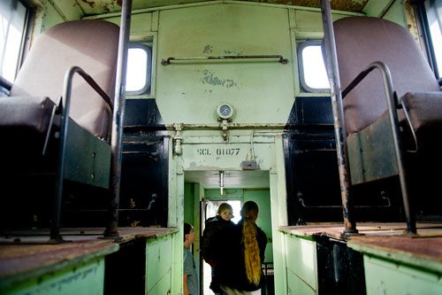  Brian Putnam (right) carries his daughter Eden as he and his son Seth walk through a caboose at the Southeastern Railway Museum in Duluth on Thursday, January 3, 2013. 