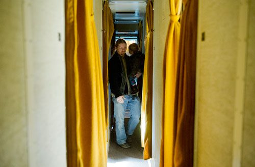 Brian Putnam (left) holds his daughter Eden as they inspect one of the passenger sleeping cars at the Southeastern Railway Museum in Duluth on Thursday, January 3, 2013.