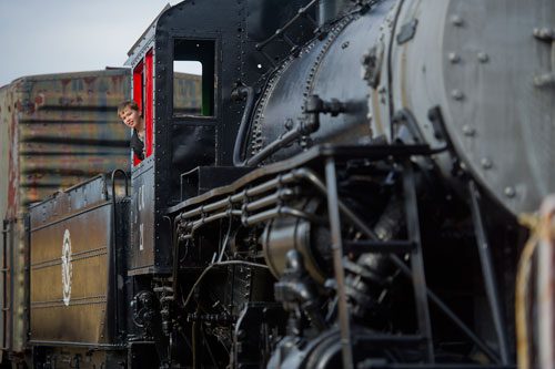 Seth Putnam leans his head out of one of the locomotive engines at the Southeastern Railway Museum in Duluth on Thursday, January 3, 2013. 
