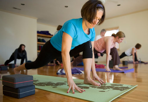 Hallie Keel holds a pose during a class at Plum Tree Yoga in Roswell on Friday, December 14, 2012. 