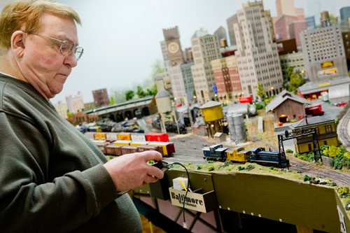 George Bloodworth operates his model trains at his home in Alpharetta on Sunday, January 6, 2013. 