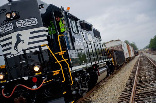 Dale Maier closes the cab to a locomotive engine after performing a safety inspection at the Norfolk Southern Training Center in McDonough on Friday, January 11, 2013. 