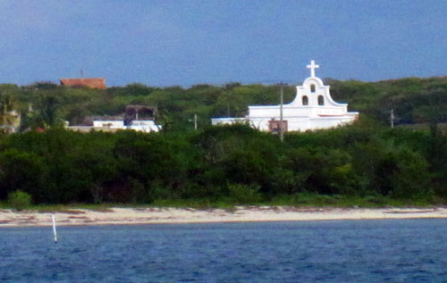 A church clears the trees along the coast of Isla Mujeres in Mexico on Thursday, January 24, 2013.