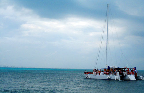 A catamaran launches from a small pier off of Isla Mujeres in Mexico on Thursday, January 24, 2013.