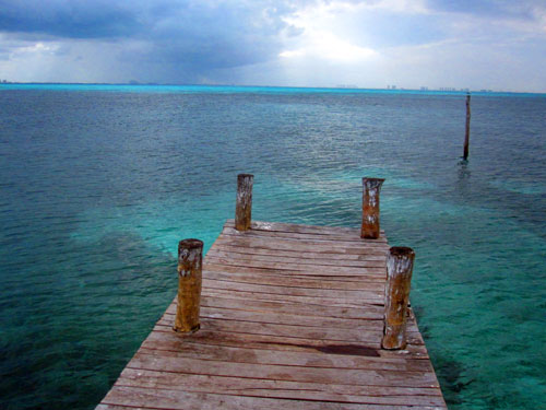A dock overlooks the water surrounding Isla Mujeres in Mexico on Thursday, January 24, 2013.