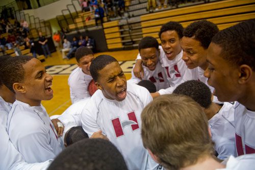 Hillgrove's Jordan Sexton (center) gets his team pumped in a huddle before their game against North Cobb on Saturday, February 16, 2013.