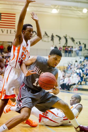 Hillgrove's Keith Ray (right) tries to push past North Cobb's Micah Woodard on Saturday, February 16, 2013.