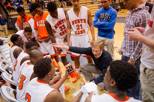 North Cobb head coach Terry Gorsuch talks to his players during a timeout in their game against Hillgrove on Saturday, February 16, 2013.