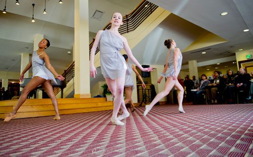 Caroline Simpkins (center), Whitney Edwards (left) and Elizabeth Chapman (right) perform "Muses in Form" inspired by the work of George Balanchine and Arthur Mitchell during Dance Canvas' History Through Dance: A Celebration of Dance Pioneers at the Rialto Center for the Arts in Atlanta on Wednesday, February 20, 2013. 
