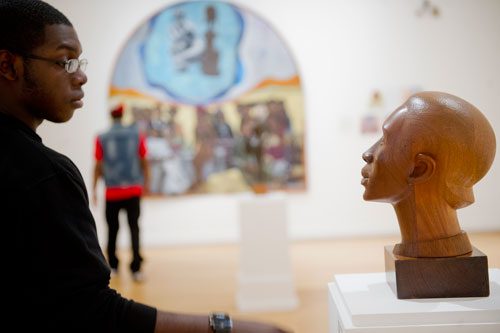 Willis Cooks (left) looks at one of the 125 pieces of art on display at the Clark Atlanta University Art Gallery on Wednesday, February 20, 2013.