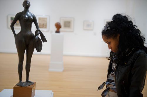 Akina Mike looks at a sculpture entitled "Bather" by Elizabeth Catlett at the Clark Atlanta University Art Gallery on Wednesday, February 20, 2013. 
