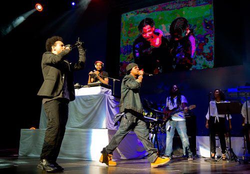  Chris Smith (left) and Chris Kelly of Kris Kross perform on stage at the Fox Theatre in Atlanta during the So So Def 20th Anniversary Concert on Saturday, February 23, 2013. 