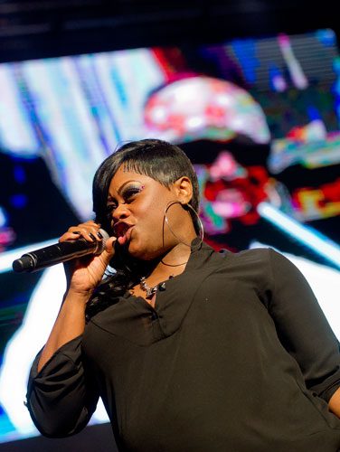 Tamika Scott from the group Xscape performs on stage at the Fox Theatre in Atlanta during the So So Def 20th Anniversary Concert on Saturday, February 23, 2013.   