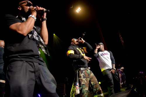 Nelly (center) performs on stage at the Fox Theatre in Atlanta with Jagged Edge during the So So Def 20th Anniversary Concert on Saturday, February 23, 2013. 