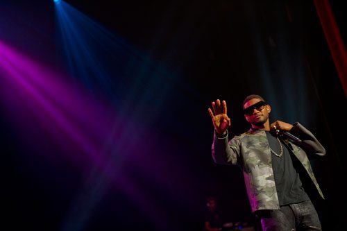 Usher performs on stage at the Fox Theatre in Atlanta during the So So Def 20th Anniversary Concert on Saturday, February 23, 2013. 