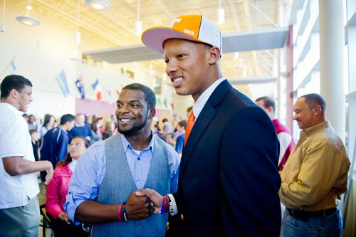 Joshua Dobbs (right) poses for a photo with head football coach Jason Dukes during the National Signing Day event at Alpharetta High School in Alpharetta, Georgia on Wednesday, February 6, 2013. Dobbs started as quarterback for Alpharetta for the past two years and has officially signed to play for Tennessee.