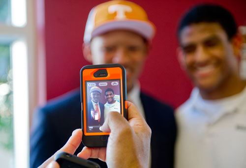 Joshua Dobbs (left) poses for a photo with friend Stuart Johnson taken by Dobbs' father Robert during the National Signing Day event at Alpharetta High School in Alpharetta, Georgia on Wednesday, February 6, 2013. Dobbs started as quarterback for Alpharetta for the past two years and has officially signed to play for Tennessee.