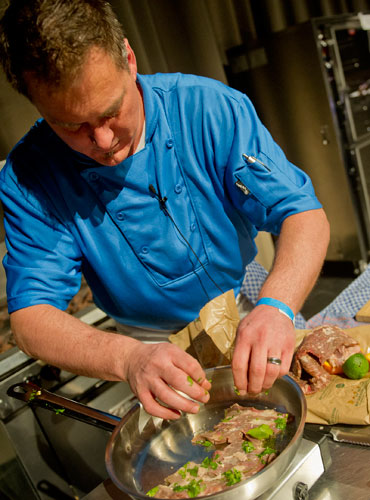 Chef Joe Arvin cooks up a storm during the 2013 Atlanta Chefs Expo at the Georgia World Congress Center in Atlanta on Sunday, February 24, 2013.