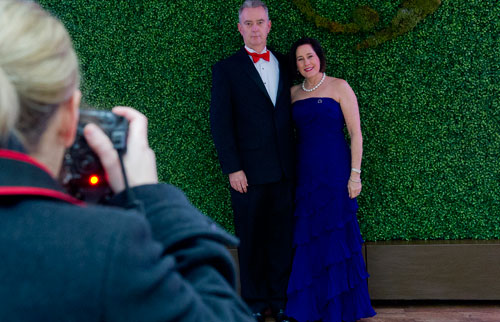 Penny Morriss (right) and Bill Campbell have their photo taken by Jacey Verhoef before entering the third annual Symphony Gala at the Woodruff Arts Center in Atlanta on Saturday, March 2, 2013. 