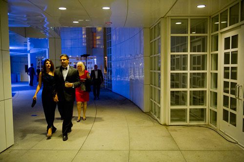 Puja Singh (left) walks hand in hand with her husband Sid as they head over to Atlanta Symphony Hall for the Steve Martin and the Steep Canyon Rangers concert as part of the third annual Symphony Gala on Saturday, March 2, 2013. 