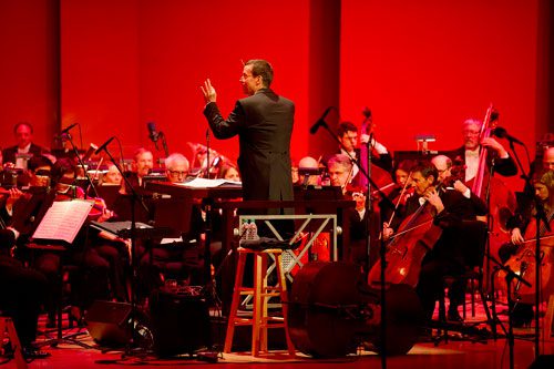 Scott Dunn conducts the Atlanta Symphony Orchestra as they open for Steve Martin and the Steep Canyon Rangers at Atlanta Symphony Hall during the third annual Symphony Gala on Saturday, March 2, 2013. 