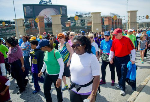 Cynthia Ware (center) walks in the Hunger Walk/Run 2013 through downtown Atlanta on Sunday, March 10, 2013.