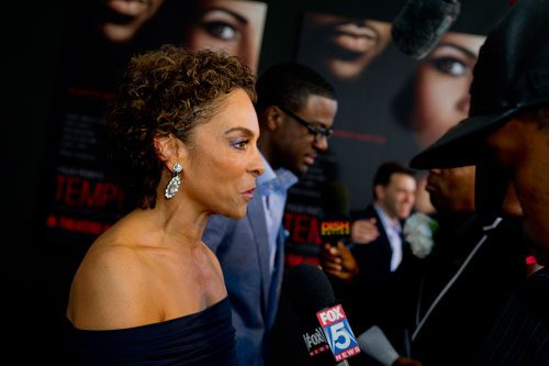 Jasmine Guy gives an interview as she walks the red carpet for Tyler Perry's new movie Temptation at the AMC Parkway Pointe 15 theaters in Atlanta on Saturday, March 16, 2013. 
