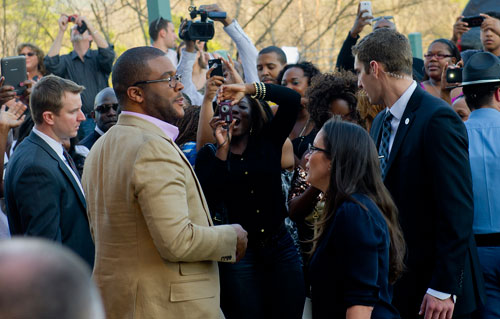  Tyler Perry greets fans before walking the red carpet for his new movie Temptation at the AMC Parkway Pointe 15 theaters in Atlanta on Saturday, March 16, 2013. 