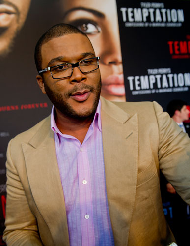 Tyler Perry walks the red carpet for his new movie Temptation at the AMC Parkway Pointe 15 theaters in Atlanta on Saturday, March 16, 2013. 