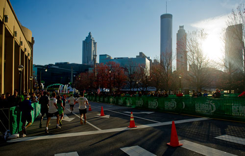 Runners make the final turn towards Centennial Olympic Park and the finish line during the 2013 Publix Georgia Marathon/Half Marathon in Atlanta on Sunday, March 17, 2013.