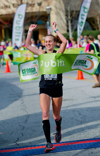 Jill Horst crosses the finish line winning the female category for the full marathon with a time of 2:58:22 during the 2013 Publix Georgia Marathon/Half Marathon in Atlanta on Sunday, March 17, 2013. 