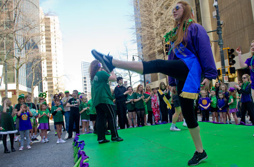 Anna Johnson (right) performs an Irish dance in front of the reviewing platform during the 131st Atlanta St. Patrick's Day Parade on Saturday March 16, 2013.