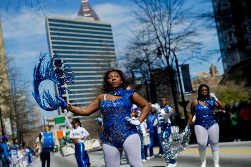 Treeshanea Bartee (center) marches down Peachtree Street with the New Edition Marching Band during the 131st Atlanta St. Patrick's Day Parade on Saturday March 16, 2013. 