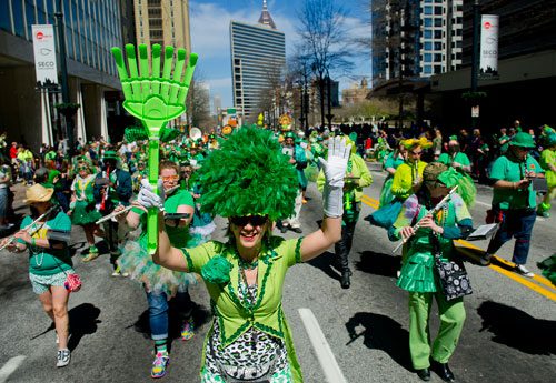 Colleen Goidel leads the Seed & Feed Marching Abominable down Peachtree Street during the 131st Atlanta St. Patrick's Day Parade on Saturday March 16, 2013.