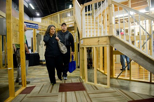 Rosa Hoskinson and her husband Jim walk through the SeeThru House display during the 35th Annual Spring Atlanta Home Show at the Cobb Galleria Center in Atlanta on Saturday, March 23, 2013.
