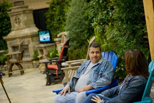 Laurence Leonard (left) talks with his wife Julie as they sit in chairs in a backyard display during the 35th Annual Spring Atlanta Home Show at the Cobb Galleria Center in Atlanta on Saturday, March 23, 2013. 