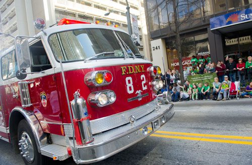A New York Fire Department engine makes its way down Peachtree Street during the 131st Atlanta St. Patrick's Day Parade on Saturday March 16, 2013.