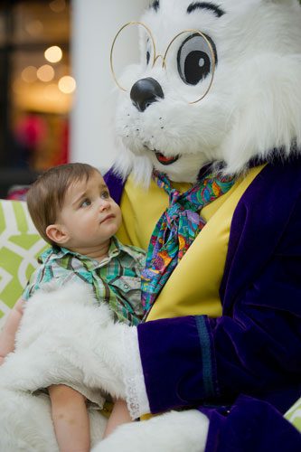 Conor Coy looks up at the Easter Bunny as he sits on his lap at North Point Mall in Alpharetta on Thursday, March 21, 2013.