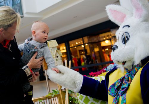 Leigh Whitmer (left) introduces her son Colton to the Easter Bunny at North Point Mall in Alpharetta on Thursday, March 21, 2013.