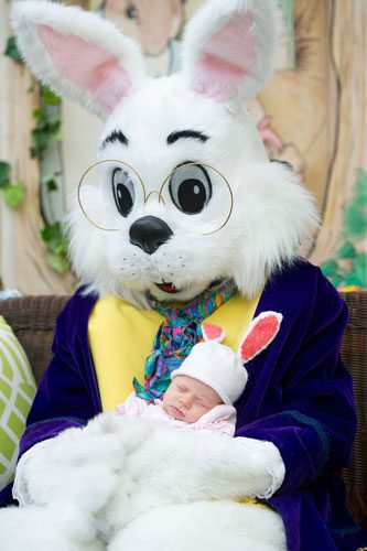 Caroline Johnson sleeps as she is held by the Easter Bunny at North Point Mall in Alpharetta on Thursday, March 21, 2013. 