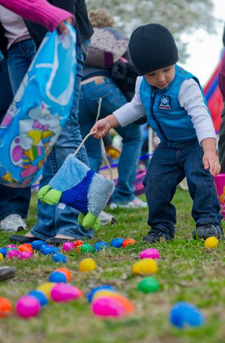 Jomian Martinez picks up eggs during the Easter Egg Hunt at Nash Farm Battlefield in Hampton on Friday, March 22, 2013. 