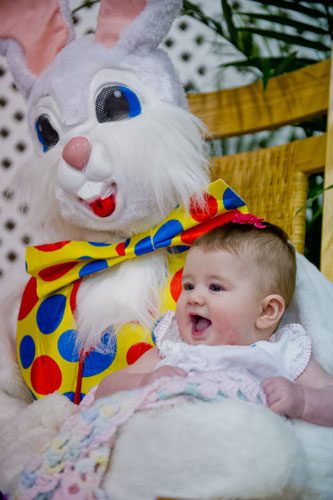 Avery Whitehead poses for a photo with the Easter Bunny during the fifth annual Easter Egg Hunt at Hebron Christian Church in Winder on Sunday, March 24, 2013.