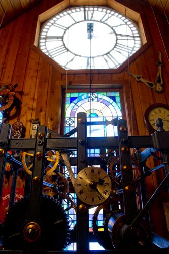 The gears of a giant clock tick off the seconds at Champ's Clock Shop in Douglasville on Saturday, March 9, 2013.