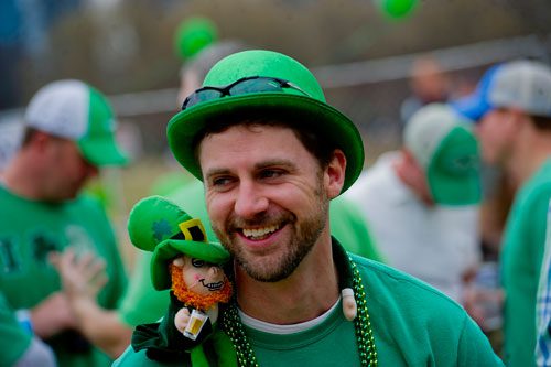 Matt Dellinger laughs with friends with a leprechaun on his shoulder during LuckyFest 2013 at Park Tavern in Atlanta on Saturday, March 9, 2013. 