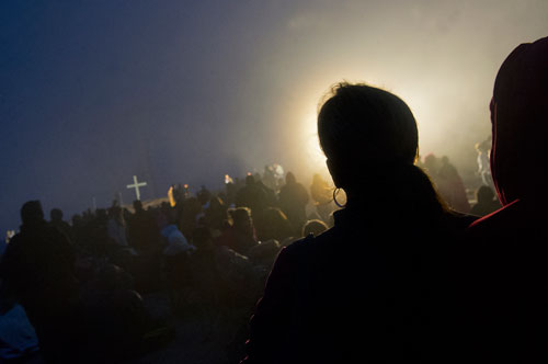 Thomas Barber (right) stands next to Allison Morgan during the 69th annual Easter Sunrise Service on top of Stone Mountain at Stone Mountain Park on Sunday, March 31, 2013.