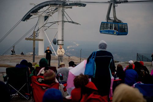 Dr. Paul Ballard (center) speaks to worshipers on top of Stone Mountain during the 69th annual Easter Sunrise Service at Stone Mountain Park on Sunday, March 31, 2013. 