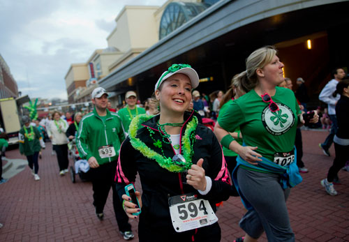 Andrea Huot (594) runs in the 5k during the Junior League of Atlanta's 9th annual ShamRock 'N Roll Road Race on Sunday, March 10, 2013. 