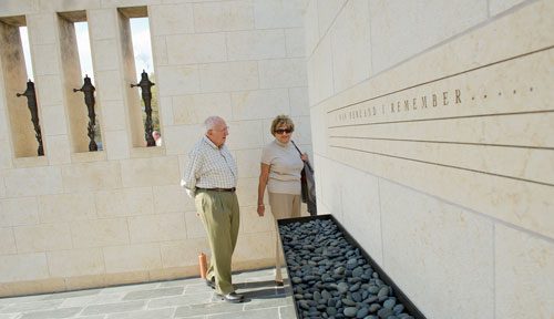 Donald Reisman (left) and his wife Shirley walk through the Besser Holocaust Memorial Garden at the Marcus Jewish Community Center of Atlanta in Dunwoody after a Yom HaShoah commemoration ceremony on Sunday, April 7, 2013. 